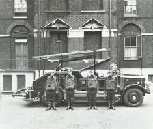 Crew in breathing apparatus, London Fire Brigade Headquarters, London, 1934. Artist: Unknown.
