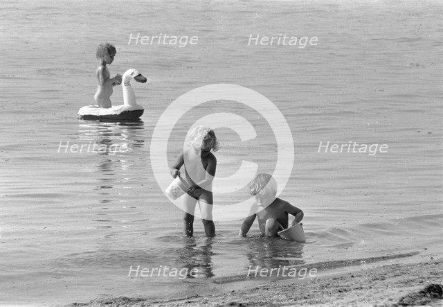 Children bathing in the Öresund, Bostahusen, Landskrona, Sweden 1966. Artist: Unknown