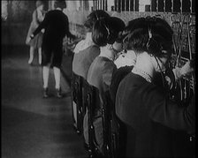 Female Civilians on Roller Skates Working in a Telephone Exchange, 1929. Creator: British Pathe Ltd.