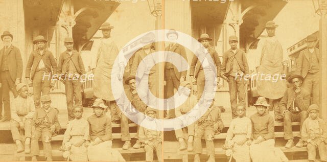 Simplicity, Alabama, U.S.A. [Group gathered on a porch, in town], (1868-1900?). Creator: Benjamin West Kilburn.