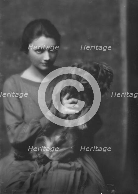 Miss Katharine Cornell, with dog, portrait photograph, 1917 Nov. 20. Creator: Arnold Genthe.