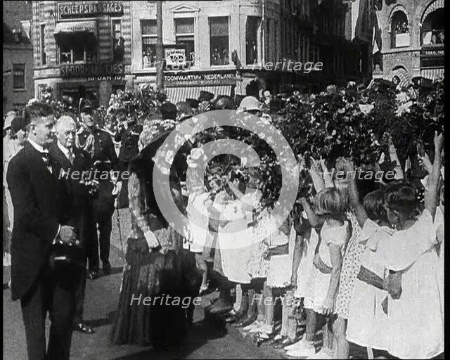 Wilhelmina, Her Majesty the Queen of the Netherlands Taking Flowers from Young Girls, 1930s. Creator: British Pathe Ltd.