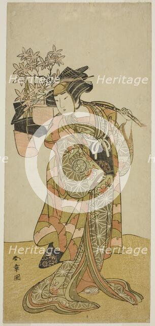 The Actor Yamashita Kinsaku II as Odai, an Eboshi (Hat) Seller, in the Play Hana-zumo..., c. 1775. Creator: Shunsho.