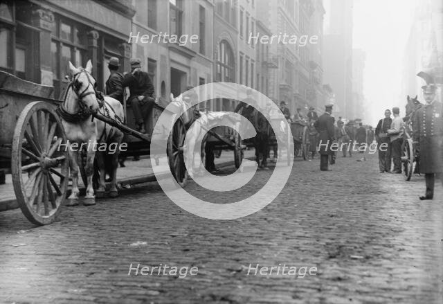 Garbage carts protected by police, 1911. Creator: Bain News Service.