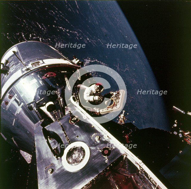 Module pilot David Scott emerging from Apollo 9 spacecraft, 6 March 1969. Creator: Russell Schweickart.