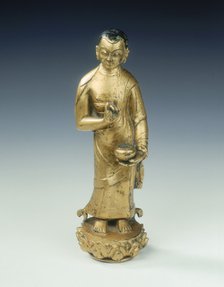 Gilt bronze statue of a standing monk with begging bowl, Yuan dynasty, China, 14th century. Artist: Unknown