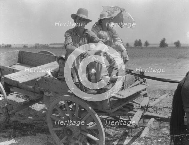 Drought-stricken farmer and family near Muskogee, Oklahoma, 1939. Creator: Dorothea Lange.