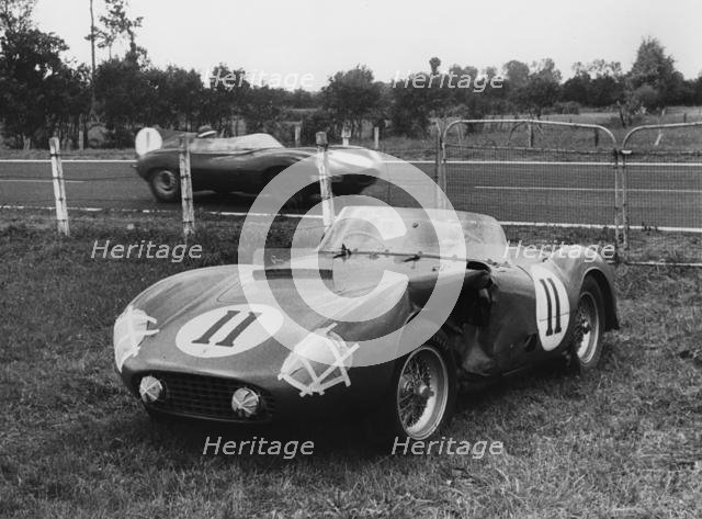 1955 Le Mans, Hawthorn's Jaguar D type passes de Portago's stricken Ferrari. Creator: Unknown.