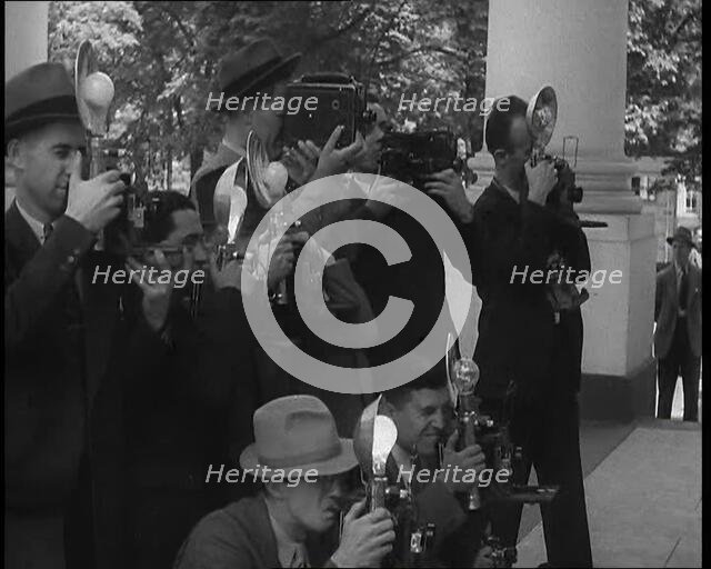 Photographers Photographing Henry Ford Arriving at the White House, 1930s. Creator: British Pathe Ltd.