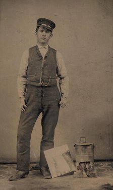 Tinsmith with Coal Heater and Sheet of Tin, 1870s-80s. Creator: Unknown.
