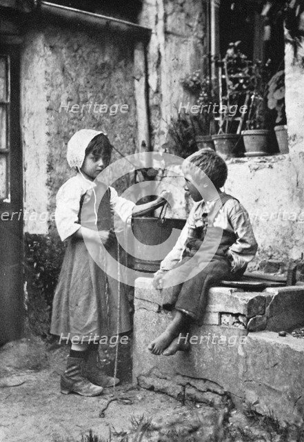 Two children in a backyard, 902-1903.Artist: Constance Ellis