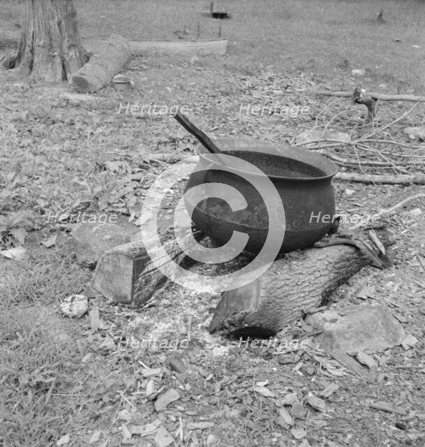 Iron pot for heating...in the yard of Negro tobacco farmer, Person County, North Carolina, 1939. Creator: Dorothea Lange.