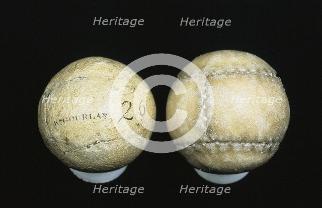 Original and reproduction of feathery golf balls, original c1830-c1840. Artist: William Gourlay