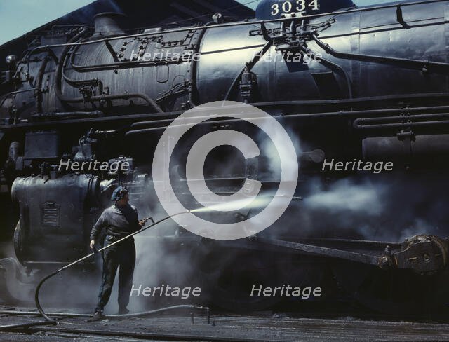 Mrs. Viola Sievers, one of the wipers at the roundhouse giving a giant "H"..., Clinton, Iowa, 1943. Creator: Jack Delano.
