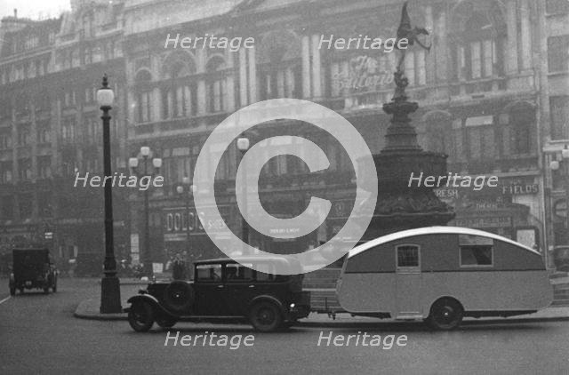 1930 Morris Oxford Six with Winchester Streamline caravan, Picadilly. Creator: Unknown.