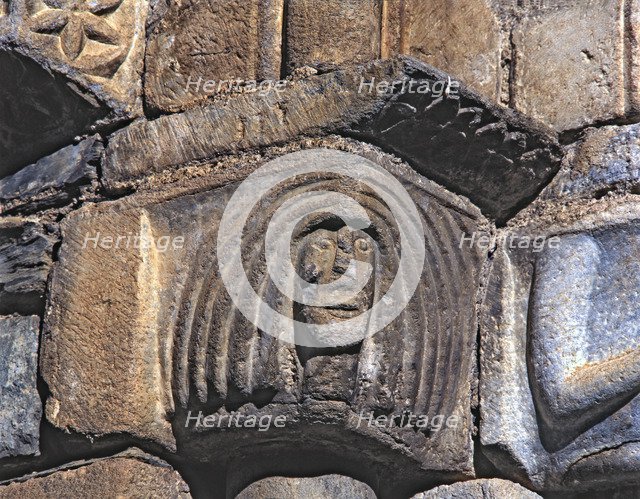  'Female Head', capital of the façade of the church of San Luis de Alos d'Aneu.