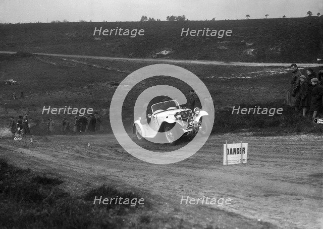 1934 Singer Le Mans competing in a motoring trial, Bagshot Heath, Surrey, 1930s. Artist: Bill Brunell.