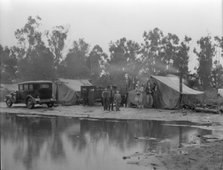 Migrant pea pickers camp in the rain, California, 1936. Creator: Dorothea Lange.