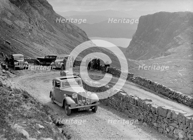 Rover 4-door saloon of IH Mackay competing in the RSAC Scottish Rally, 1936. Artist: Bill Brunell.