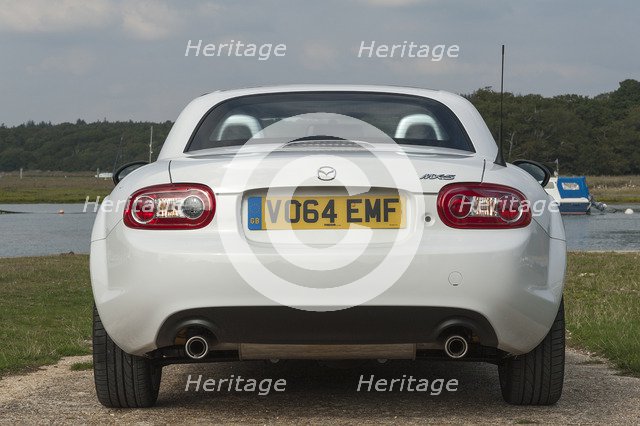 2014 Mazda MX5 Roadster Coupe Artist: Unknown.