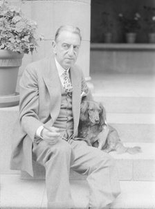 Alanson, Bertram, Mr., with dog, seated on steps, 1927 Creator: Arnold Genthe.