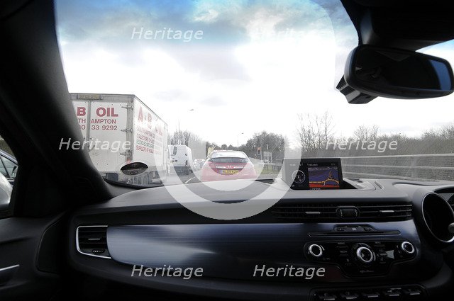 Satellite navigation system in Alfa Romeo Giulietta 2011 in heavy traffic Artist: Unknown.