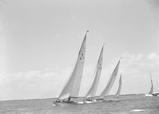 Group of 8 Metre sailing yachts racing close-hauled. Creator: Kirk & Sons of Cowes.