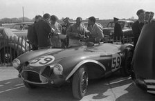Aston Martin DB3S, Stirling Moss in paddock at Goodwood International Sports Car Race 1956. Creator: Unknown.
