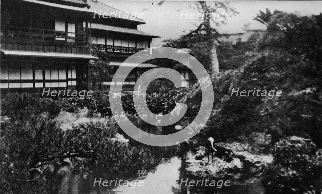 'A tea-house garden, Tokyo. Landscape gardening with theme of volcanic origins', c1900, (1921). Artist: Julian Leonard Street.
