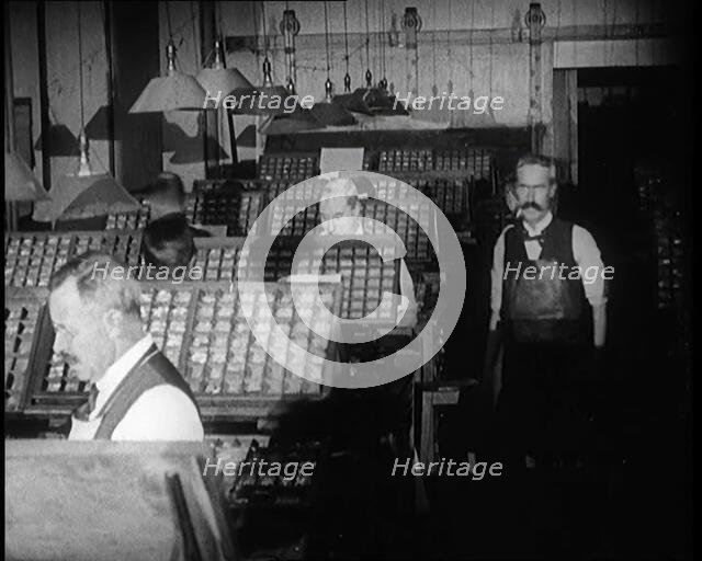 Journalists Working in the Compositing Room of a Newspaper Office, 1921. Creator: British Pathe Ltd.
