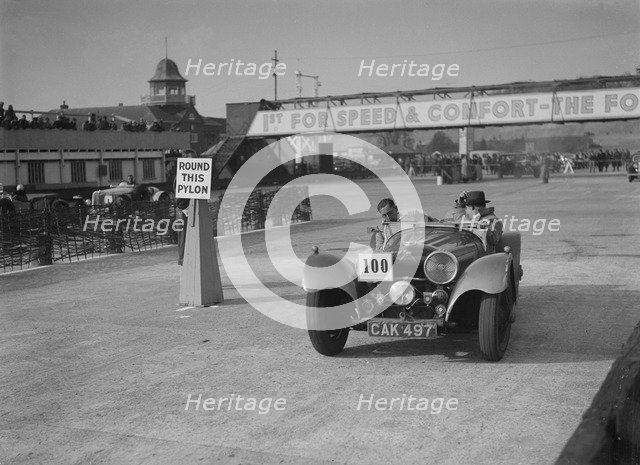Jaguar SS 100 competing in the JCC Rally, Brooklands, Surrey, 1939. Artist: Bill Brunell.
