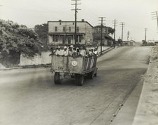 The last truckload of cotton hoers from Memphis bound for the Wilson Cotton..., June 1937. Creators: Farm Security Administration, Dorothea Lange.