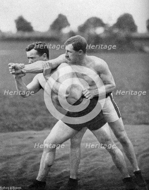 The flying mare outside, wrestling display, Aldershot, Hampshire, 1896. Artist: Gregory & Co