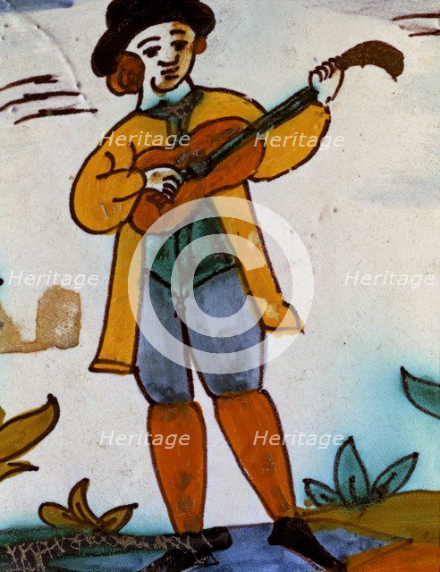 Catalan ceramics, polychromed tile of the series 'Trade Tiles'. Musician.