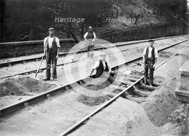 Railway tracklayers at work, Bodmin Road Station, Cornwall, 1901. Artist: Alfred Newton & Sons.