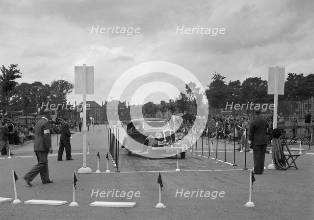 Standard saloon of Mrs SH Richards competing in the South Wales Auto Club Welsh Rally, 1937 Artist: Bill Brunell.
