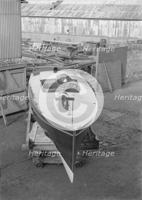 Motor launch in boatyard, 1913. Creator: Kirk & Sons of Cowes.