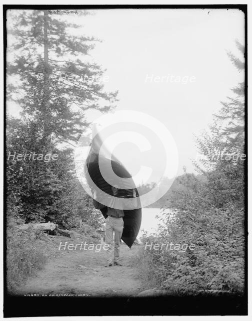 An Adirondack carry, c1902. Creator: William H. Jackson.