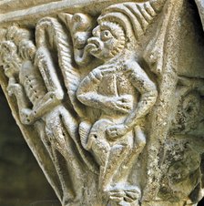 Detail of a capital of the Monastery of Santa Maria de l'Estany representing a little devil with …