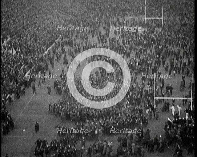 People Crowding the Pitch After an American Football Game, 1922. Creator: British Pathe Ltd.