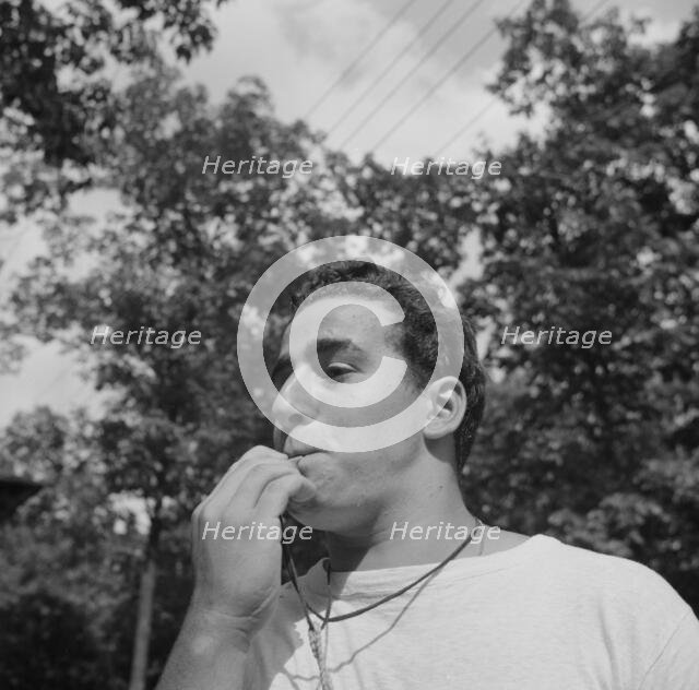 The town crier, Danny Poocchiari., Camp Nathan Hale, Southfields, New York, 1943 Creator: Gordon Parks.