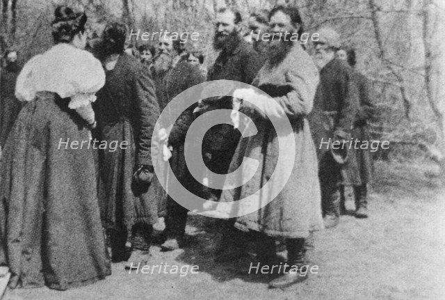 Landowner giving the Paschal greeting to her peasants, Russia, 1890s. Artist: Unknown