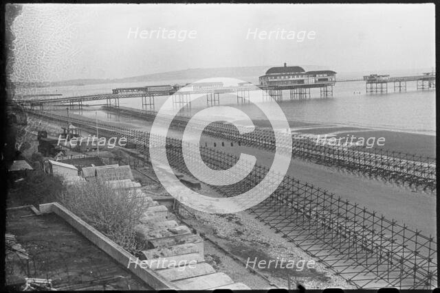 Looking north-east over the beach at Shanklin, showing Admiralty scaffolding, Isle Of Wight, 1945. Creator: George R Long.