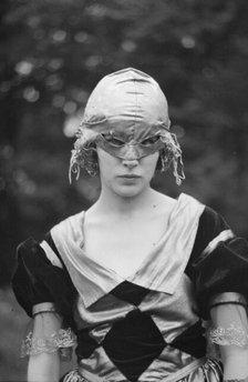 Cutter, Helen, Miss, wearing a mask, 1921 or 1922. Creator: Arnold Genthe.