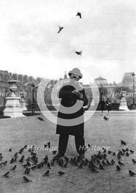 A bird charmer, Paris, 1931.Artist: Ernest Flammarion