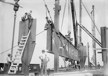Putting 46 ton girder in place - Cons. Gas Co's Bldg., 1913. Creator: Bain News Service.
