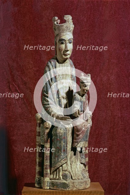 Seated Virgin and Child on the left knee, carving in polychromed wood.