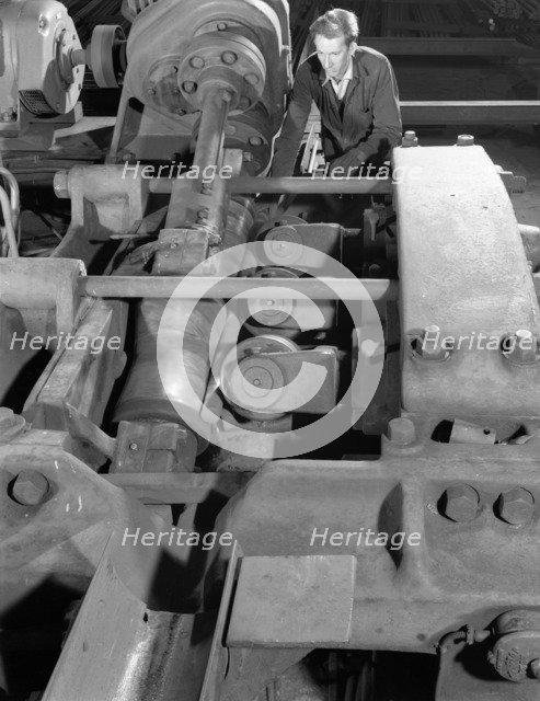 Straightening round bars, J Beardshaw & Sons, Sheffield, South Yorkshire, 1963.  Artist: Michael Walters