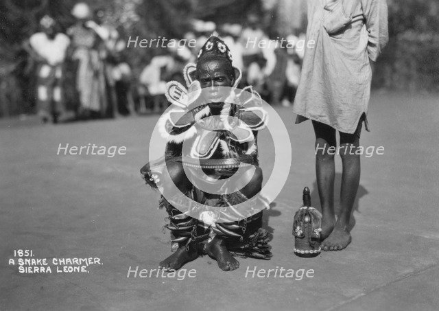 Snake charmer, Sierra Leone, 20th century. Artist: Unknown