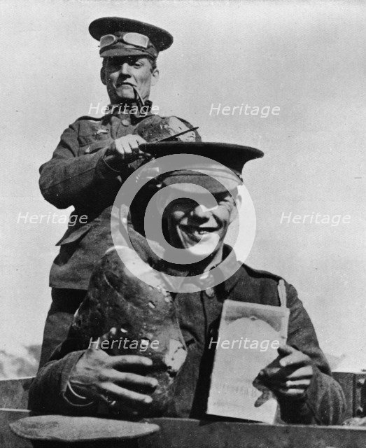 'The Soldier and his Rations: A photograph taken at one of the British camps in France', 1914. Artist: Unknown.